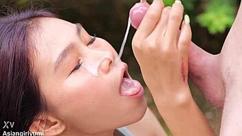 A girl gets a portion of cum on her face for smiling